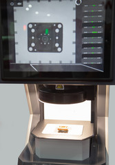 Workpiece part inspecting on optical measuring machine. Industrial manufacture.