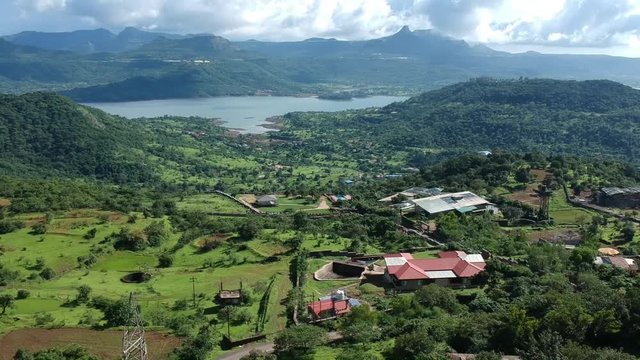 Road trip on Indian road in Monsoon - Rainy season seen here at Dudhiware Khind (pass) at Lonavala, India - most selling stock aerial drone footage.