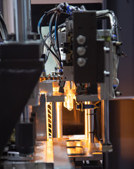 Process of raw material of plastic bottle on blowing machine pre-heat process. Industrial manufacturing production line