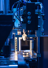 Process of raw material of plastic bottle on blowing machine pre-heat process. Industrial manufacturing production line