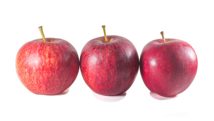 Three ripe fresh red apples standing on white background