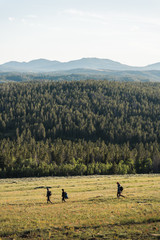Hikers walking down a hill near Lander, Wyoming during summer.  © Rosemary