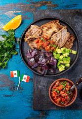 Yucatan Mexican Food Pork POC CHUC poc chuck. Pork marinaded in orange juice served with avocado, purple onion and rustic tomato sauce.