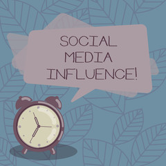 Writing note showing Social Media Influence. Business photo showcasing Individuals ability to affect others thinking Blank Rectangular Color Speech Bubble Overlay and Analog Alarm Clock