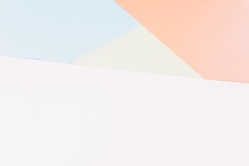 Flat layout of minimal colourful layer of pastel pink, green,  blue and orange paper background.