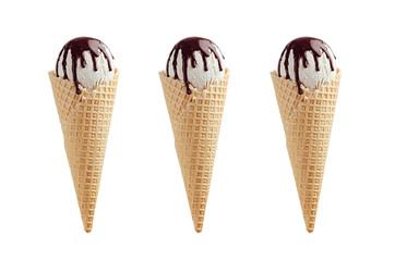 Set of three white ice cream in crisp waffle cones with chocolate sauce isolated on white  background.