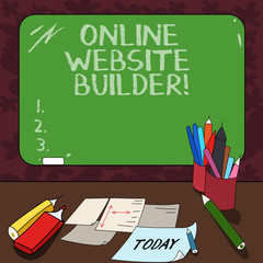 Word writing text Online Website Builder. Business concept for Program or tool that help you construct a website Mounted Blank Color Blackboard with Chalk and Writing Tools Sheets on Desk