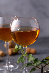 White wine in a glass. The concept of winemaking. Place under your text. Still life on a textural background.
