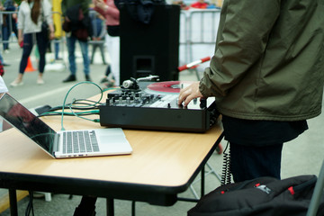 DJ plays music in the city street