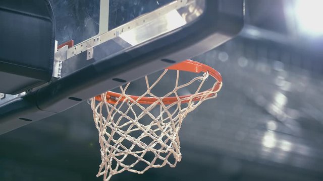 Stadium basketball hoop low angle shot 50p to 25p slomo