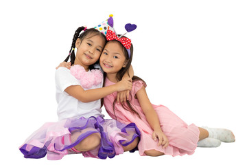 Two Asian Kids hugging Cheerful together And Smiling Fun Celebration party isolated on white background. clipping path. Object, Birthday or Childhood, Holidays, Friendship and Celebration Concept