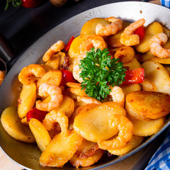 a delicious fried potato and shrimp pan