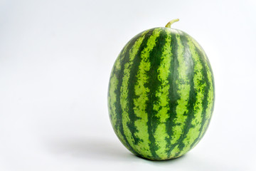 Green watermelon balls on a white background.
