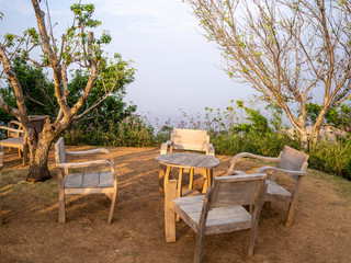 table and chairs  on a lawn at the garden