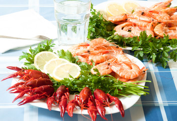 cooked shrimp and crayfish on plate close up
