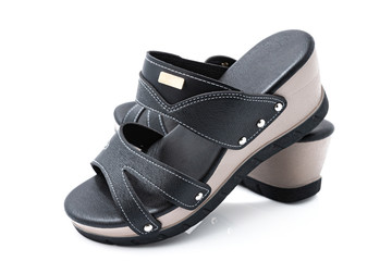 Stylish female leather shoes in black colors isolated on white background. Beauty and fashion concept.