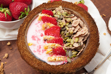 Healthy summer breakfast. Jar with granola, yoghurt and strawberry