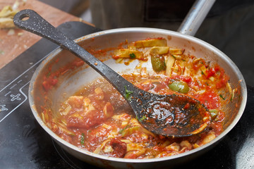 Cooking sauce for pasta in frying pan. close up photo
