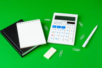 Green office desk with white stationery, copy space