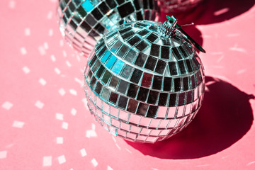 disco ball bauble on pink background.  party concept