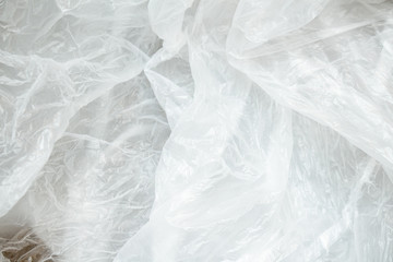 Obraz premium White crumpled plastic background close up polyethylene