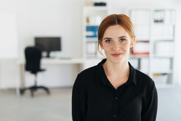Young businesswoman with a quiet friendly smile