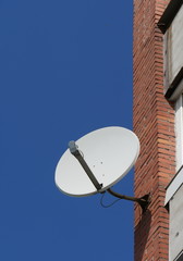 satellite antenna on the wall of the house