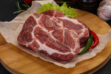 Raw pork neck steak