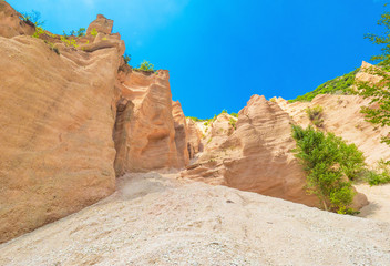 Fototapeta na wymiar Fiastra lake and Lame Rosse canyon - Naturalistic wild attraction in the Monti Sibillini National Park, province of Macerata, Marche region, central Italy