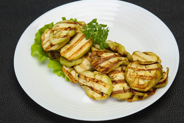 Grilled eggplant slices served basil