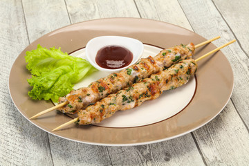 Minced pork skewer kebab with sauce