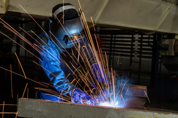 Industrial worker is welding repair his work in factory