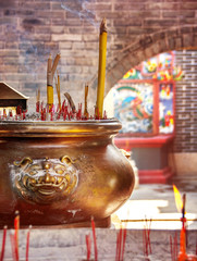 Burning incense sticks close up in tradional temple in Hong Kong