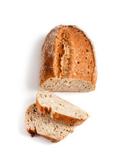 Loaf of whole wheat bread with slices isolated on white background