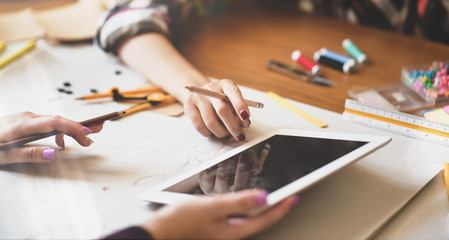 Designer presenting her ideas to coworkers
