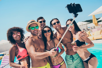 Six wet after swimming friends hanging out enjoying best company drinking ice cocktails making selfies