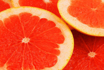 Red grapefruit slices texture