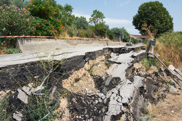 Big pothole on a national road in Sicily caused by landslide, carelessness and abandonment of road maintenance