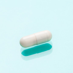 White medicine capsules probiotic powder inside. Close up. High resolution product. Health care concept - Image