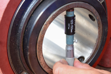 Technician use a Inside Micrometer to measure the diameter inside of the inner ring of bearing.