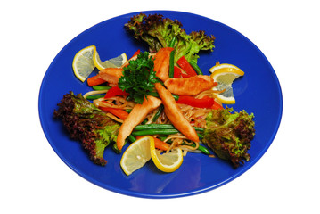 Salad with green on a plate on a white isolated background