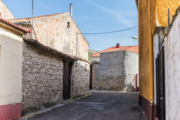 Typical village street with stone house