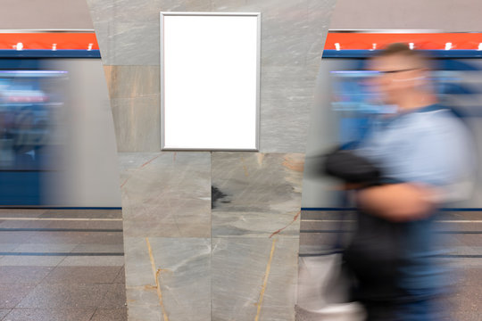 Mock Up Banner, Billboard At Metro Station. Blurred Movement People On Background Rectangular Layout Small Banner And Train Movement. Advertising In The Subway, Large Lobby.