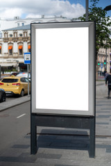 Mock up rectangular vertical lightbox on street in city. Advertising construction. Copy space. billboard on sidewalk narrow street. Against backdrop building and roadway.