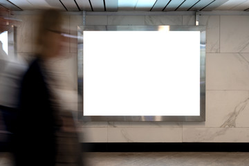 Mock up lightbox in underpass. Blurred movement people against background lightbox layout. Advertising in tunnel, transition.