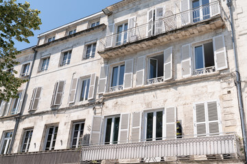 Fototapeta na wymiar building in city center of La Rochelle in France with balcony