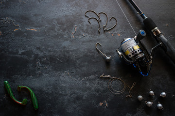 fishing gear and space for text on a black background © itakdalee