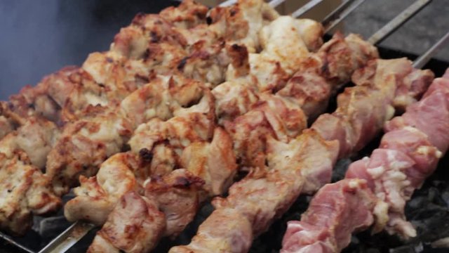 pork skewers of meat cooked on a spit on coals close up. barbecue meat