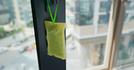 Hanging a pack of the refresher for Mosquito Repellent
