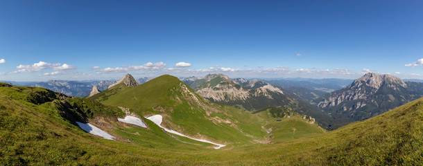 Fototapeta na wymiar Panoramic view from mountain Wildfeld in the Ennstaler Alps with surrounding summits Stadelstein,Schwarzenstein and Eisenerzer Reichenstein in summer.